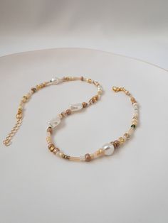 "Elegant Mixed color seed beads and cream pearl. Gift for Choker. Elegant necklaces that you can present to yourself or your loved ones on special occasions. Elegant choker necklaces that you can use separately or together are 14 inches and have a 1.5 inch adjustable chain. If you want to visit my earring store \" ladyearringshop \" *There is no delivery to military areas. *Hawaii is only shipped via express shipping. (You are requested to choose express shipping.) *Puerto Rico shipments are not Neutral Beaded Necklace, Beige Beaded Necklace With Gold Round Beads, Beige Beaded Chain Necklace With Round Beads, Beige Jewelry With Colorful Beads For Jewelry Making, Elegant Beige Beaded Necklaces With Colorful Beads, Beige Necklace With Colorful Round Beads, Elegant Beige Beaded Necklace With Colorful Beads, Beige Beaded Chain Necklace Gift, Beige Beaded Chain Necklace As Gift