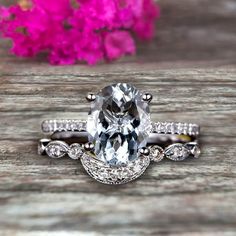 an oval cut engagement ring set with diamond accents