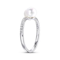 This pretty bypass ring showcases a pair of lustrous round freshwater cultured pearls meeting at the center. Shimmering round white lab-created sapphires twinkle as they line the sterling silver setting for a delightful finishing touch. Fine Jewelry Pearl Ring In Diamond White, Fine Jewelry Diamond White Pearl Rings, Pearl White Pearl Ring For Anniversary, White Diamond Ring With Pearl Drop For Anniversary, White Gold Pearl Ring With Center Stone, White Pearl Rings With Brilliant Cut, White Diamond Rings With Pearl Drop, White Pearl Drop Ring For Anniversary, White Pearl Rings With Diamond Accents