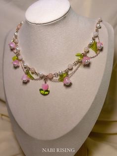 🌸 Embrace the enchanting beauty of nature with our whimsical fleur necklace. Crafted with pink opals and romantic flower charms, this necklace exudes feminine charm and elegance.  ⭐️Crystal Properties ⭐️ This necklace includes pink opal, which is closely associated with the heart chakra, emotional healing, gentleness, compassion, and tranquility.  💧❌ ~For optimal care, I recommend you to remove the necklace before showering, sleeping, or engaging in strenuous activities~ --------------- ⚒️MATERIAL  -Pink opal, faux pearls, glass, acrylic  -Rose gold plated /stainless steel hardware and chains  - Gold plated /stainless steel extender chain  🌎SHIPPING - This item will be shipped within 2~5 days (USA)  - All items come in an individual gift box  📲CONTACT - Follow "nabirising" on Instagram Pink Butterfly Necklace, Pink Flower Pendant Necklace With Clavicle Chain, Pink Flower Pendant Clavicle Necklace, Delicate Pink Pendant Flower Necklace, Delicate Pink Flower Pendant Necklace, Whimsical Flower-shaped Jewelry, Pink Flower Charm Pendant Necklace, Pink Flower Necklace With Clavicle Chain, Pink Bohemian Necklace With Flower Charm