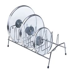 three round plates on a metal rack with wheels