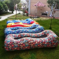 an inflatable mattress is laying on the grass