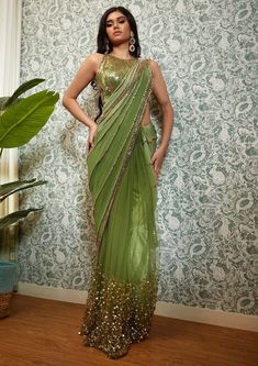 Bollywood Style Embellished Festive Pre-draped Saree, Party Wear Pre-draped Saree With Zari Work For Diwali, Festive Pre-draped Sequined Dola Silk Saree, Festive Party Wear Pre-draped Saree With Resham Embroidery, Embellished Fitted Dola Silk Saree, Festive Silk Pre-draped Saree With Sequins, Bollywood Style Festive Pre-draped Saree With Sequins, Sequin Pre-draped Chinon Saree, Party Wear Pre-draped Saree With Mirror Work For Navratri