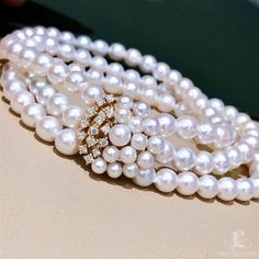 Highlight: Classic Double Strand Bracelet Product Information OriginJapan MaterialAkoya Pearl, 18k Gold, and Diamond DimensionsLength Approx. 17.5 cm Pearl Shaped: Round Size: 6-7 mm Quality: AAA Nacre: Very Thick Color: White Luster: Aurora Accessories Metal: 4.2g of 18K Gold Other: 0.33ct of SI Quality Natural Diamond Luxury White Pearl Bracelet With Diamonds, Luxury White Diamond Pearl Bracelet, Luxury Yellow Gold Pearl Bracelet With Round Beads, Luxury Diamond Pearl Bracelet In Yellow Gold, Luxury White Gold Akoya Pearl Bracelet, White Pearl Bracelet With 17 Jewels, Luxury Yellow Gold Diamond Pearl Bracelet, White Diamond Pearl Bracelet For Anniversary, White Pearl Diamond Bracelet For Anniversary