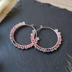 These small, beaded hoops were made with Miyuki glass beads in various pink and purple shades. Miyuki beads are known for their high quality, uniformity, and vibrant colors. These hoop earrings are also available with other color gradients. In my shop Baffling Beads AT you can find a variety of beaded jewelry pieces - I focus on earrings, hair accessories such as woven beads and bracelets. All my handmade jewelry pieces were designed and crafted by me and are completely handmade. Pink Small Hoop Beaded Earrings As Gift, Summer Hoop Earrings With Tiny Beads For Gift, Pink Hoop Beaded Earrings For Festival, Handmade Pink Hoop Earrings Gift, Pink Hoop Earrings With Tiny Beads As Gift, Pink Hoop Earrings With Tiny Beads For Gift, Bohemian Pink Hoop Earrings With Round Beads, Adjustable Pink Hoop Earrings, Nickel-free Pink Beaded Hoop Earrings