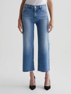 Our Saige Wide Leg Crop features a mid-rise waist and loose, cropped legs with stringy raw hems. Cut from 11.75 oz. Vintage Comfort Stretch Denim, these five-pocket jeans have a light indigo wash and marigold stitching. Fading, worn edges, and a bit of distressing near the pockets create an 18-year AG-ed™ Denim look that emulates authentic lived-in character.Vintage Comfort Stretch Denim, 11.75 oz. 98% Cotton, 2% ElastaneSome styles previously labeled as 'High-Rise' have been reclassified as 'Mi Ag Jeans, Straight Leg Denim, Crop Jeans, Mid Rise Jeans, Cropped Jeans, Wide Leg Jeans, Stretch Denim, Denim Dress, Amazing Women