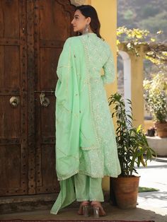 This is a beautiful 3-piece set. The set comes with printed & embroidered anarkali style kurta has mandarin collar, calf length & 3/4th sleeves teamed with trouser solid pants and an organza dupatta with border & gota detailing. Total No of Set-3 Suit Fabric : Cotton Dupatta Fabric-Organza Work Done on Kurta- Print & embroidery detailing Kurta Length-Calf Length Sleeve Length : 3/4th Sleeves Neck : V Neck Style : Anarkali Color : Green & Beige Occasion : Party Wear Washing Instructions: Hand Was Embroidered Anarkali, Print Embroidery, Embroidery Detailing, Cotton Dupatta, Organza Dupatta, Suit Fabric, Green Beige, Womens Size Chart, Embroidery Details