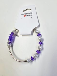 Purple single strand  beaded bracelet made with memory wire and glass beads Adjustable Purple Beaded Bracelet With Silver Beads, Adjustable Purple Jewelry With Silver Beads, Purple Beaded Bracelets With Silver Beads For Jewelry Making, Adjustable Pearl Bracelet With Large Beads As Gift, Purple Beaded Bangle Jewelry, Adjustable Purple Faceted Beads, Purple Bracelet With Silver Beads, Adjustable Elegant Purple Beads, Adjustable Purple Beaded Bracelet With Faceted Beads