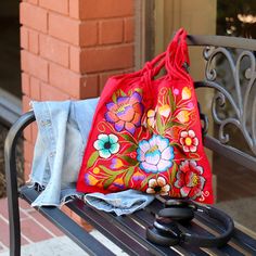 This unique bag is beautifully made on a waist loom, (Telar de Cintura) by our artisans in San Juan Andres Larraizar Chiapas México.Each bag is individually handwoven and embroidered with a unique design. There is not other like it! Use this reusable and eco-friendly, 100% cotton loom tote bag as a shopping bag for farmer's markets . Dress it down with a t-shirt and jeans or shorts! or to add a boho vibe to any outfit. Details: - Tote measurements: 14” x 16.5” (L x W)- Handle drop: 10"- Material T Shirt And Jeans, Unique Bags, Boho Vibe, Artisan Craft, Cotton Totes, Cotton Tote Bags, Handmade Bags, Loom, Hand Embroidered