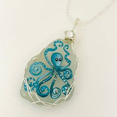 "Teal Octopus sea glass necklace - Hand painted Silver plated 18\" chain with Swarovski crystal. painted and crafted to order. Please do take a minute to view my many one of a kind hand painted items :-)" Unique Handmade Sea Glass Jewelry, Handmade Unique Sea Glass Jewelry, Hand Painted Blue Sterling Silver Necklace, Handmade Ocean-inspired Sea Glass Necklaces, Ocean-inspired Silver Glass Necklace, Ocean-inspired Silver Glass Jewelry, Ocean-inspired Recycled Glass Jewelry As Gift, Nickel-free Recycled Glass Necklace As A Gift, Whimsical Silver Resin Jewelry