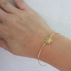 Rose Bracelet - Rose Jewelry - A gold tone pure brass rose flower charm has been transformed into a dainty & delicate rose flower bangle bracelet with a gold tone brass band. Perfect for those who like Victorian jewelry themes! I can also make this rose bangle bracelet with a 14k gold filled band for an additional $10. If you would like this option for your rose jewelry, select from options when ordering. This gold rose bracelet stacks great with other bangles from my collection as you can s Gold Flower Bracelets With Rose Design, Gold Floral Bracelets With Rose Design, Gold Flower Bracelet With Rose Design, Delicate Adjustable Rose Jewelry, Delicate Adjustable Rose-colored Jewelry, Adjustable Gold Bracelet With Rose Design, Adjustable Gold Rose Design Jewelry, Gold Bracelet With Rose Design For Gift, Delicate Gold Jewelry With Roses