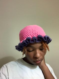 Pink and purple crochet ruffle hat Purple Crochet Beanie For Beach, Purple Crochet Beanie For The Beach, Winter Yarn Hats With Ruffles, Purple One Size Brimmed Crochet Hat, Pink Spring Hat With Ruffles, One Size Purple Brimmed Crochet Hat, Purple Brimmed Crochet Hat One Size, Ruffled Crochet Beach Hat, One Size Fits Most, Purple Brimmed Crochet Hat