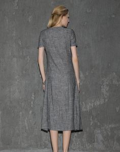 A cool linen dress is an absolute must-have in any woman's wardrobe. The loose-fitting style of this gray dress will give you not only comfort but also a fabulous silhouette no matter what size you are. Whether you decide to wear this dress for lounging around the house or at the office, you'll know that you'll be able to keep cool. Anyone who has experienced the coolness of wearing cool linen fabric would never want to not own linen clothing. This is especially true when it comes to women's dre Casual Gray A-line Midi Dress, Gray Shift Dresses For Summer, Gray Knee-length Midi Dress For Summer, Gray Knee-length Summer Midi Dress, Casual Long Dress For Workwear, Spring Gray Shift Dress, Gray Fitted Short Sleeve Maxi Dress, Casual Gray Knee-length Dress, Fitted Casual Linen V-neck Dress