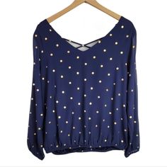 Torrid Navy Chiffon Long Sleeve Elastic Hem Lattice Blouse. Navy With Gold Polka Dots. Lightweight And Strappy Blouse Cast From Sheer Navy Chiffon Dotted With Gold Foil Is Effortless And Endlessly Flattering. Lattice V-Neck. Back V-Neck. Partially Lined. Semi-Sheer Sleeves. Elastic Hem And Sleeves. Chiffon Fabric. Torrid Size 00 Is Equivalent To A Size Medium / Large Or A Size 10. Shell: 100% Polyester; Lining: 100% Polyester. New With Tag. Hem Elastic Is Slightly Twisted, But Doesn't Affect The Fitted Blue Chiffon Blouse, Blue Flowy Blouse For Party, Long Black Blouse, Strappy Blouse, Black Sleeveless Shirt, Lace Sleeve Top, Plaid Tunic, Floral Print Chiffon, Gold Polka Dots