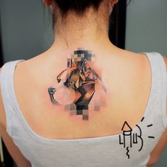 a woman with a tattoo on her back