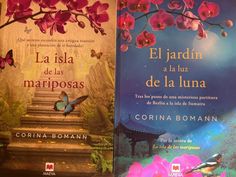 two books are sitting side by side in front of a wall with flowers and butterflies on it