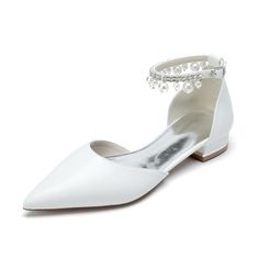 a pair of white shoes with pearls on the heel