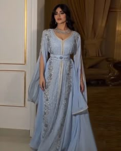 Elevate your style with our Dreamy Vow Luxury Dubai Moroccan Kaftan. Featuring a stunning blue evening dress with elegant long sleeves, this dress is perfect for any formal occasion. Made with high-quality materials, it's perfect for a wedding party or any special event. Stay elegant and stylish with this Muslim Arabic formal dress. Prom Dresses Arabian Nights, Arabian Wedding Dress, Muslim Formal Dress, Arabian Princess Dress, Blue Kaftan Dress, Moroccan Wedding Dress, Ornate Dress, Arab Dresses, Custom Flower Girl Dress