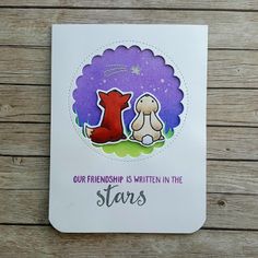 a card with a dog and cat on it that says, our friend is written in the stars