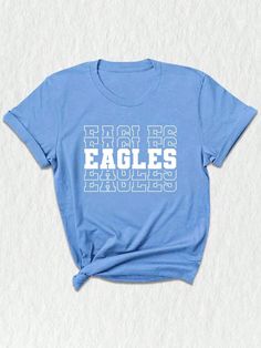 a blue t - shirt with the words eagles printed on it