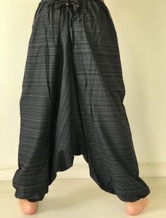 "These super soft rayon baggy unisex harem pants have the \"flow\", perfect of yoga or just a cool strolling. Comfort and character are what these pants are all about. They have the traditional sarong look & feel but a lot more practical when it comes to activity like yoga. As a bonus, they are convertible! Just pull them up and you get yourself a cute jumpsuit in a flash. Together with elastic cuff legs, you can wear them short or long. The pants have smock waist (wide bang elastic) with no Baggy Full-length Cotton Harem Pants, Baggy Cotton Harem Yoga Pants, Baggy Harem Cotton Yoga Pants, Loose-fit Cotton Harem Yoga Pants, Yoga Harem Pants With Drop Crotch And Relaxed Fit, Yoga Harem Pants With Drop Crotch, Relaxed Fit Drop Crotch Harem Pants For Yoga, Cotton Drop Crotch Harem Pants For Yoga, Baggy Full-length Harem Pants For Yoga