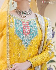 Royal Pakistani Yellow Dress for Mehndi Function is a stunningly vibrant and breathtaking attire for your magical day. Bridal Sharara paired with Short Kameez emblazoned with silver work and embroidery creates a lavish and classic attire. Shirt: Gorgeous Short Kameez in vibrant yellow color has chikankari chiffon fabric. Its elegant neckline is gracefully adorned with floral designs and silver work enhancing its stylish look. Long sleeves give a more traditional touch to this Traditional Bridal Dress For Mehndi Function, Dresses For Mehndi Function, Dress For Mehndi, Mayoon Bride, Sharara Suit Designs, Bridal Sharara, Mehndi Function, Yellow Kurti, Indian Wedding Lehenga