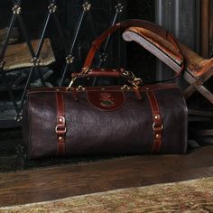 Grab attention with this full-grain, dry-milled American Buffalo duffel. Perfect for weekend travel. Full-grain American Buffalo with American Steerhide trim Dimensions: 11” (H) x 21” (W) x 11” (D) Adjustable shoulder strap: 39″ to 57″ Solid brass hardware and unique closure Large interior & exterior pockets for added storage May be personalized Leather Garment Bag, Luxury Travel Bag, Buffalo Bison, American Buffalo, Leather Duffel Bag, Leather Duffel