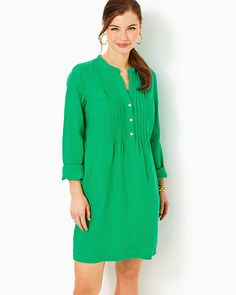 Easy fit, tunic shirtdress with a stand collar, half placket with a front pintuck detail, side slits, and pockets. 36" from top of shoulder to hem (based on a size small/4). Skims the body. Roomier fit. Enjoy extra hem flexibility with this style. Wear as-is or let it out for some extra length.  Lagoon Linen™ (100% Linen). Machine wash cold, delicate cycle, separately, or dry clean. Imported. An easy and colorful daytime essential, the Rhoda Linen Dress is embellished with a stand collar and pintuck details, plus practical pockets. Spring Workwear Tunic With Buttons, Classic Spring Shirt Dress With Pleated Sleeves, Spring Collared Tunic For Workwear, Spring Button-up Tunic For Workwear, Classic Shirt Dress With Pleated Sleeves For Spring, Spring Workwear Collared Tunic, Spring Long Sleeve Shirt Dress With Pleated Waist, Elegant Tunic With Buttons, Long Sleeve Shirt Dress With Pleated Waist For Daywear