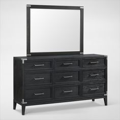 a black dresser with a mirror on top and drawers below it, in front of a white background