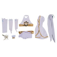 an assortment of clothing and accessories on a white background, including one dress with gold trim