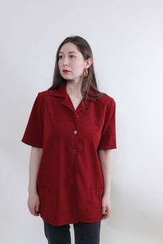 Hi! This is vintage from 90s orange color button up minimalist heavy blouse. This top made of synthetic material - PE 100%. The model in the photo is 170 cm tall and is wearing a LARGE size shirt.But, be careful, this is a vintage size, it is better to check the measurements below in the product description. Sleeve - 40cm / 15.74inch; Width - 58cm / 22.83inch; Length - 80cm / 31.49inch. All measurements are taken seam to seam while lying flat. Sleeve measurement made from armpit to end of sleeve Short Sleeve Office Blouse With Pockets, Formal Shirt With Pockets And Short Sleeves, Formal Short Sleeve Shirt With Pockets, Red Short Sleeve Tops For Office, Retro Short Sleeve Office Top, Retro Short Sleeve Top For Office, Formal Short Sleeve Tops With Pockets, Vintage Short Sleeve Blouse With Pockets, Retro Short Sleeve Tops With Pockets