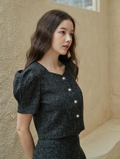 This is a trendy and feminine blouse by bibyseob that is made out of high quality and sturdy material. With distinctive mood of the design and modern feminine look, you can style it for your casual daily outfit.- Feminine mood and high quality fabric- Set up with matching skirt- Unique button closure on the front- Puffy short sleeves Chic Tweed Tops For Fall, Trendy Black Blouse For Office Wear, Black Office Lady Top For Workwear, Black Office Lady Blouse For Fall, Casual Tweed Tops For Spring, Elegant Tweed Tops For Fall, Black Office Blouse For Fall, Tweed Blouse, Feminine Blouses