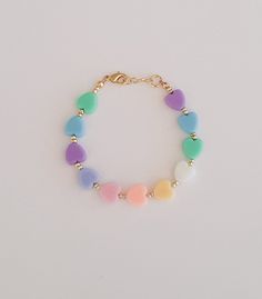 "If you would like to add gold filled hardware to a bracelet, please use this link to purchase it along with the bracelet. You will need to purchase one for EACH bracelet you would like to add gold filled hardware to. https://www.etsy.com/LittleLovliesShop/listing/860546443/gold-filled-upgrade?utm_source=Copy&utm_medium=ListingManager&utm_campaign=Share&utm_term=so.lmsm&share_time=1598757365437 Rainbow Heart Bracelet. These colorful pastel beads are aligned in a rainbow pattern a Trendy Heart Beads Jewelry For Birthday, Trendy Heart Beaded Jewelry For Birthday, Mother's Day Bracelets With Heart Beads, Heart Charm Bracelets For Birthday, Cute Nickel-free Friendship Bracelets, Cute Heart Beads Bracelets For Mother's Day, Heart Bracelets With Heart Charm For Birthday, Adjustable Heart Beads Jewelry For Birthday, Cute Heart Beaded Bracelets For Mother's Day