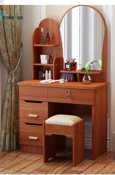 a wooden dressing table with mirror and stool