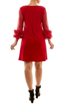 Mesh 3/4 length sleeves with ruffled cuffs accent a round neck dress for an en vogue style. 36" length (size S) Round neck 3/4 length mesh sleeves with ruffle cuffs Slips on over head Unlined 95% polyester, 5% spandex Machine wash cold Imported Model stats: 5'10" height, 32" bust, 25" waist, 36" hip. Model is wearing size S. Party Dress With Ruffles And 3/4 Sleeves, Elegant Half Sleeve Dress With Ruffles, Elegant Half Sleeve Ruffled Dress, Elegant 3/4 Sleeve Dress With Ruffle Hem, Elegant Dress With 3/4 Sleeves And Ruffle Hem, Elegant Dresses With 3/4 Sleeve And Ruffle Hem, Mesh Sleeve Dress, Vogue Style, Round Neck Dress