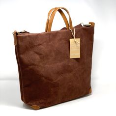 Uashmama Alle Bag - Andrew Pearce Bowls Modern Brown Canvas Bag For On-the-go, On-the-go Travel Bag With Leather Trim And Double Handle, Classic Hobo Bag With Leather Handles For On-the-go, Waxed Canvas Bags With Leather Trim For On-the-go, On-the-go Bucket Bag With Leather Handles, Luxury Brown Canvas Bag With Removable Pouch, Modern Canvas Bag With Removable Pouch For Everyday Use, On-the-go Satchel With Leather Handles, On-the-go Satchel With Leather Trim And Double Handle