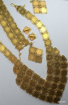 "Fabulous Etruscan Style gold plated filigree panel jewelry set/ parure: necklace, bracelet, clip on earrings and pierced earrings. The bracelet is 7 1/4\"\" long and 1 1/4\" wide and it has a flip over clasp. It has a 2\" long secure chain with the spring clasp The necklace , clip on earrings and the bracelet are marked \" D'Orlan\". The regular earrings are not marked. The inside necklace measurement is 17 inches and 5/8\" wide at the widest point.The middle ornamental piece is 6\" long and 3\ Gold Costume Jewelry Sets For Evening, Elegant Gold-tone Jewelry With Filigree, Elegant Gold-tone Filigree Jewelry, Ornate Filigree Jewelry For Evening, Gold Plated Filigree Jewelry In Gold, Yellow Gold Filigree Metal Jewelry, Yellow Gold Filigree Jewelry, Gold-tone Wedding Earrings, Gold Jewelry Sets With Matching Earrings For Party