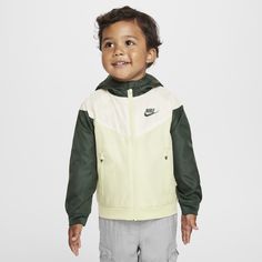 The Nike Sportswear Windrunner Jacket is made with smooth, durable fabric that has the classic 26° chevron design. Zippered side pockets give little ones a place to put their hands. Spring Nike Outerwear For Gym, Green Sports Outerwear With Zipper Closure, Nike Green Outerwear With Adjustable Hood, Nike Sporty Hooded Jacket For Spring, Sporty Green Track Jacket With Zipper Closure, Nike Green Hooded Jacket For Sports, Nike Sporty Windbreaker, Green Hooded Nike Windbreaker, Green Hooded Moisture-wicking Outerwear