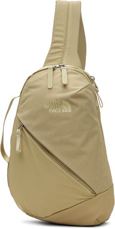 the north face sling backpack in beige