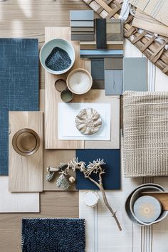 an assortment of materials are arranged on the floor with blue and white colors in them