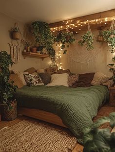 a bed with lots of plants on the headboard and lights hanging from the ceiling