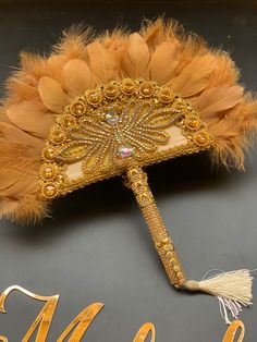 a masquerade with feathers and beads on it