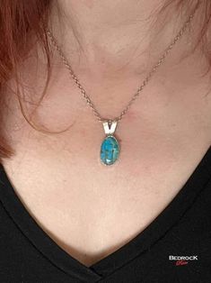 "Add elegance to any outfit with this irresistible Kingman Turquoise pendant. The pendant is framed with a castellated silver bezel. This dainty pendant, with its faceted chain, should sit just below your collarbone and complement just about any neckline in your wardrobe. H: .75\" W: .5 Chain: 18\", hypoallergenic, tarnish resistant, lobster clasp  Feel free to contact me if you have specific chain length requirements; I am happy to accommodate special requests! A bit about Turquoise: Turquoise was initially mined and brought to Europe in the 16th century via Turkey, hence its name. Kingman turquoise is from Arizona. It has a distinct sky-blue to greenish-blue color. American turquoise tends to be more greenish due to higher levels of iron. The turquoise featured in the Bedrock Rose collec Elegant Turquoise Cabochon Pendant Necklace, Turquoise Necklace With Large Oval Stone Pendant, Turquoise Necklace With Large Oval Pendant, Turquoise Necklace With Large Oval Stone, Sterling Silver Turquoise Teardrop Necklace, Elegant Sterling Silver Turquoise Pendant Necklace, Elegant Turquoise Necklace With Rectangular Pendant, Elegant Teardrop Turquoise Necklace, Elegant Turquoise Gemstone Necklace With Oval Pendant