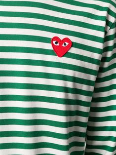 Green and white cotton striped long-sleeve T-shirt from Comme Des Garçons Play featuring a front logo patch, a two tone design, horizontal stripes, a ribbed crew neck and long sleeves. | Comme des Garçons PLAY striped long-sleeve T-shirt White Long Sleeve Tops With Logo Patch, White Long Sleeve Top With Logo Patch, Green Crew Neck T-shirt With Contrast Stripes, White Cotton Sweatshirt With Logo Patch, Green Cotton Top With Embroidered Logo, Green Cotton Tops With Embroidered Logo, Green Crew Neck Tops With Contrast Stripes, White Embroidered Patch Crew Neck Top, White Crew Neck Top With Embroidered Patch