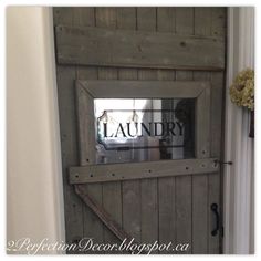 a door with a mirror on it that says laundry