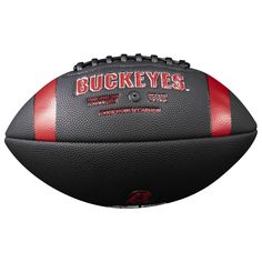 a football with the words buckeyes on it is shown in black and red