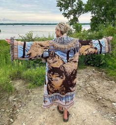 Introducing my latest creation! Upcycled two of the same beautiful vintage tapestry blankets into this cozy, oversized blanket coat.  Perfect for breezy seaside mornings, late nights at festivals, dinner dates, or campfires. This beauty is sure to turn heads wherever you may wander. Please note: this piece is comprised of acrylic woven blankets, whereas many of the other blanket coats in my shop are cotton. It is more lightweight and will have mild pilling on the material. This is normal and does not detract from the overall aesthetic of the piece. It has many years of life ahead! Measurements: Bust: 48" Overall length: 55" Shoulder seam to wrist: 24" Model is 5'10 for reference. Machine wash, lay flat to dry. This statement jacket was made with all of my heart, for any human, anywhere, th Blanket Cardigan, Tapestry Blanket, Blanket Coat, Dinner Dates, Oversized Blanket, Statement Jacket, Divine Nature, Vintage Tapestry, Woven Blanket