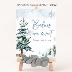 there is a sign that says babies are sweet please take a treat with snowflakes on it