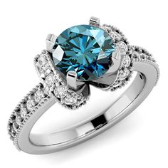 a blue and white diamond ring with diamonds on the sides, set in 18k white gold