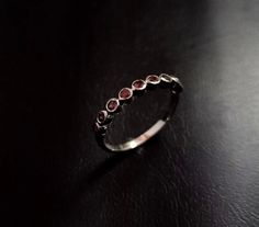 925 solid sterling silver fashionable Eternity minimalist ring, with Natural Ruby Faceted Cut Round Shaped gemstone, Ring Weight - 1.80 Gram Stone Size - 3 x 3 MM (Ruby) Ring Size - Choose From Variation Please, This ring is made from 925 sterling silver. This natural Ruby Faceted Cut ring is finely polished to give a brilliant mirror finish. With rejuvenating design and sleek appearance, this ring looks stunning on fingers. If you have any additional questions about this Product, just hit the " Silver Ruby Half Eternity Promise Ring, Silver Ruby Promise Ring With Half Eternity Band, Silver Stackable Birthstone Ring For Formal Occasions, Silver Ruby Half Eternity Ring, Silver Ruby Ring With Half Eternity Design, Silver Ruby Ring With Half Eternity Band, Elegant Silver Stackable Ruby Ring, Formal Stackable Ruby Ring In Sterling Silver, Silver Half Eternity Round Cut Ruby Ring